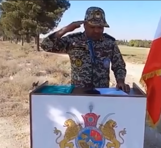 A soldier poses with the Persian lion emblem, outlawed by the IRGC