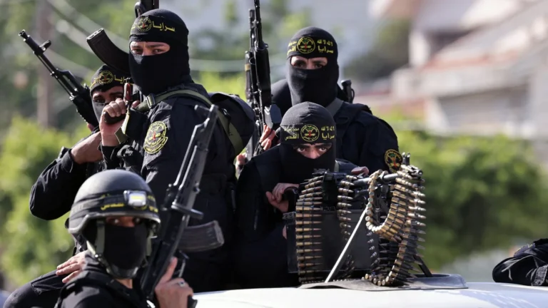 Fighters with the Palestinian Islamic Jihad movement parade with their weapons in the streets of Gaza City during a rally on 29 May 2021 (AFP).jpg